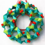 The Christmas Origami Wreath is 2 shades of green with little red berries