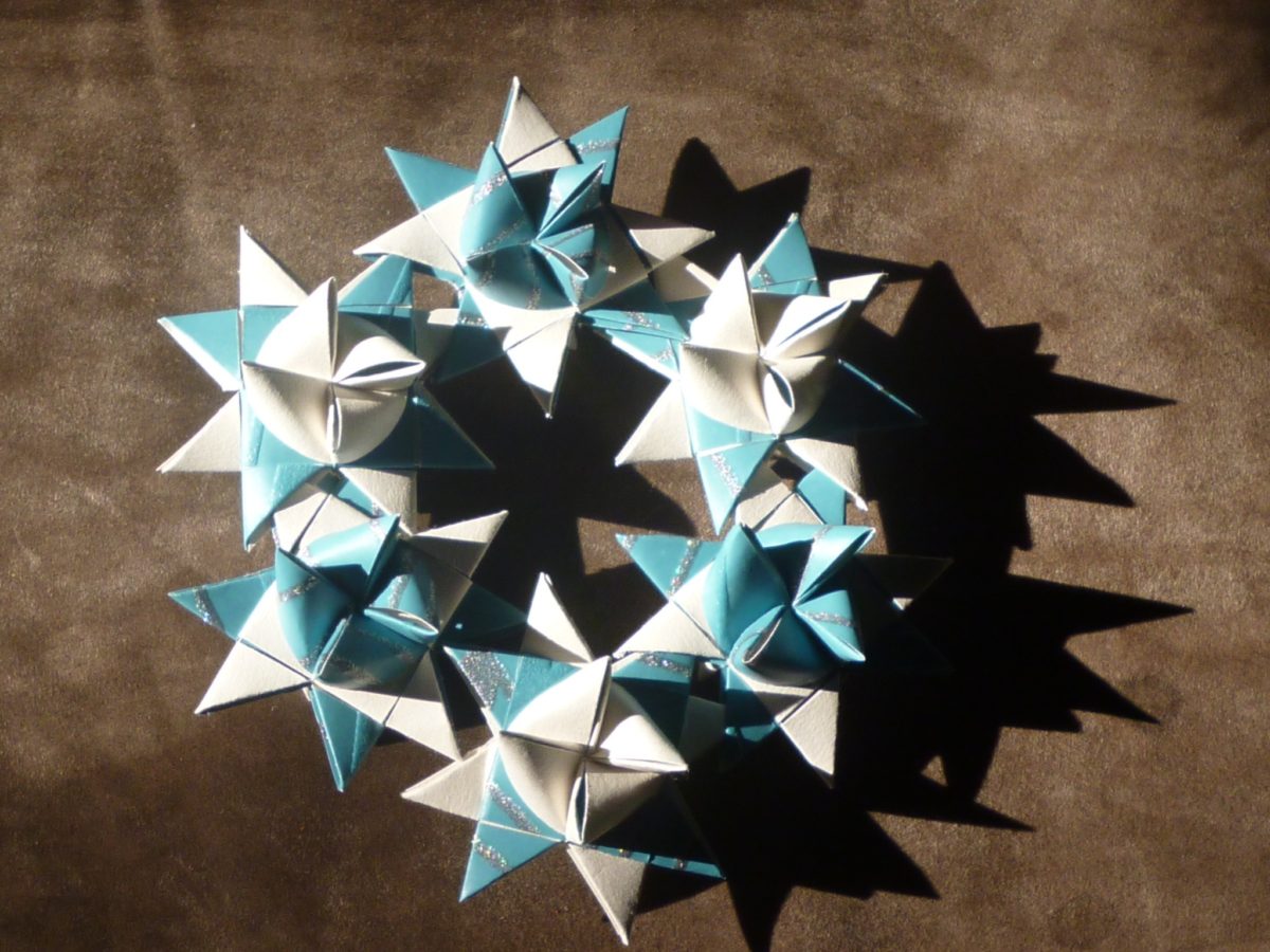 Christmas Origami Star Wreath made from blue, white and silver Froebel stars.